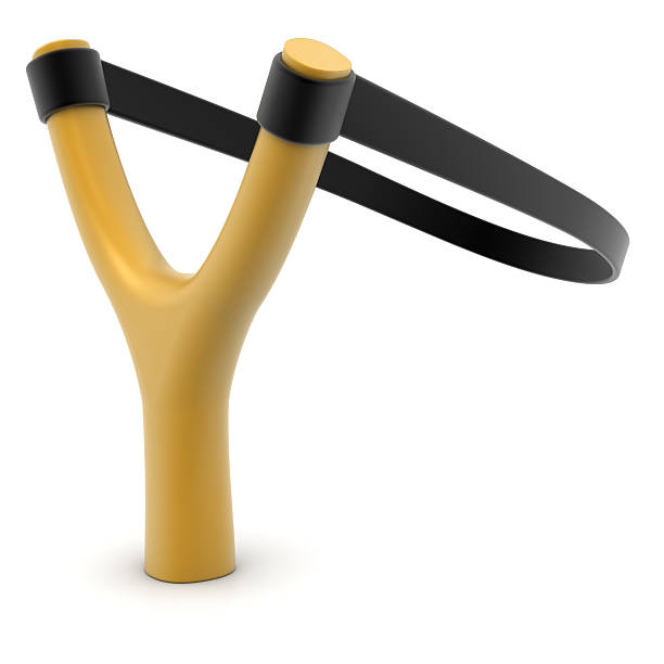 A plastic brown slingshot with black rubber  stock photo