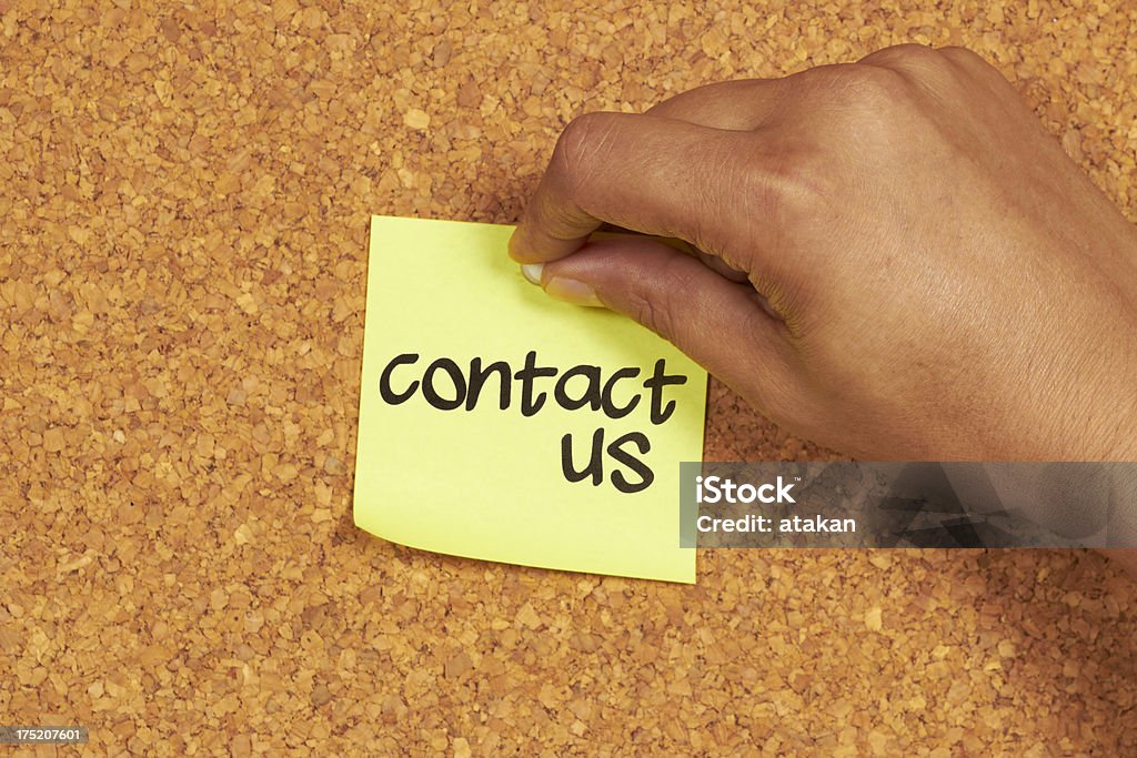 contact us pinned contact us post-it Adhesive Note Stock Photo