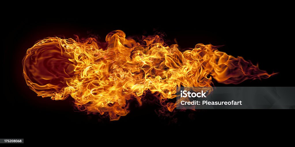 Big horizontal flying fire ball Huge and intense fireball flying horizontally on black background Fireball Stock Photo