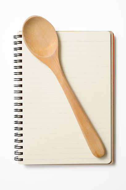 istock Blank spiral notebook with wooden spoon on white background 175208263