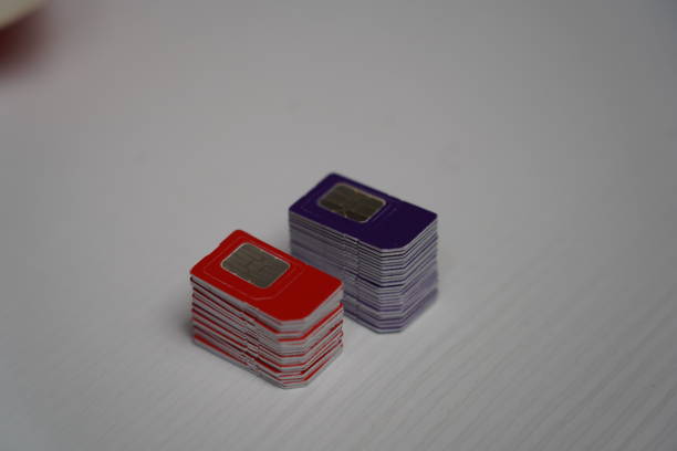 istock Many SIM cards on a laptop keyboard. Bot farm. Mobile gsm cards 1752086219