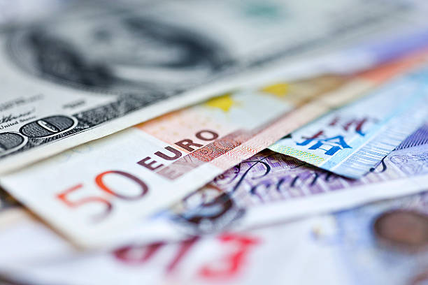 Foreign currency A pile of foreign currency. Shallow depth of field. currency exchange stock pictures, royalty-free photos & images