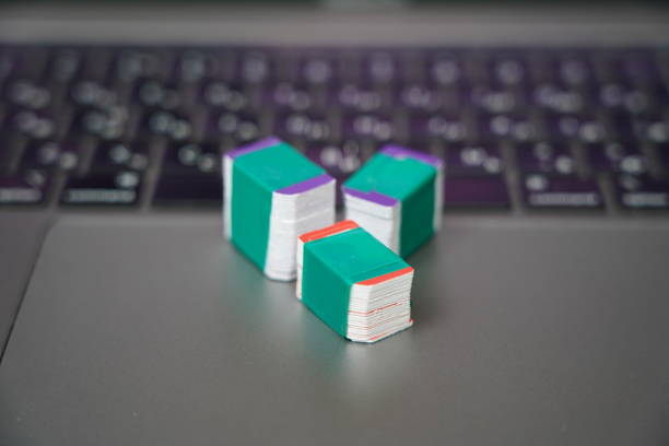 istock Many SIM cards on a laptop keyboard. Bot farm. Mobile gsm cards 1752089402