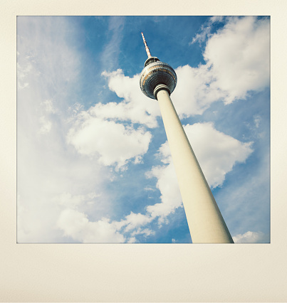 Berlin TV Tower - famous Fernsehturm at Alexanderplatz. Berlin, Germany. Polaroid Style Editing with old Pola frame. 