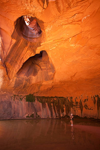 istock Woman explores Utah's Golden Cathedral natural ampitheater 175209194
