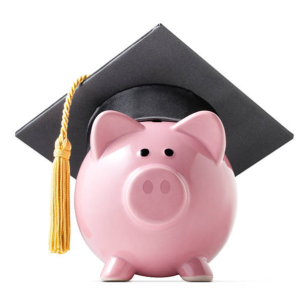 Education savings. Piggy bank with graduation cap.