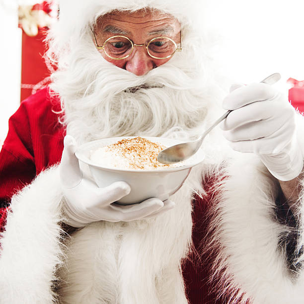 Santa Claus eating rise porridge stock photo