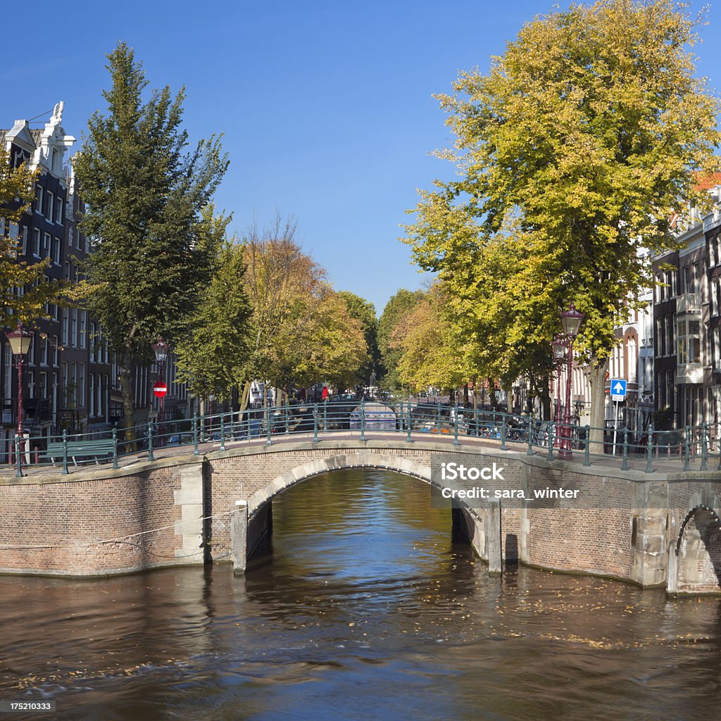 Canal in the city of Amsterdam, The Netherlands in autumn "Bridges and canals in the city of Amsterdam, The Netherlands. Photographed on a beautiful day in early autumn. A seamlessly stitched image from 4 images." Amsterdam Stock Photo