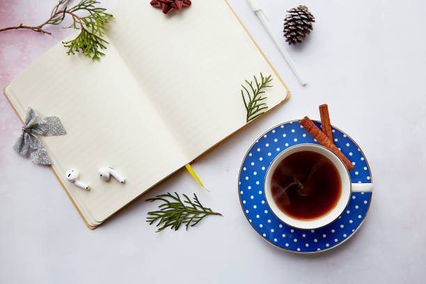 istock Christmas mockup empty notepad with aesthetics coffee cup, doughnut, wireless earphones. New year resolution, planning, new start and list of goals concept 1752103355