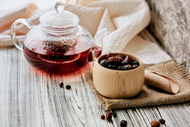istock Teapot with red berries rosehip, blueberry, raspberry, cranberry herbal tea. Vitaminized, immune boosting tea 1752103399