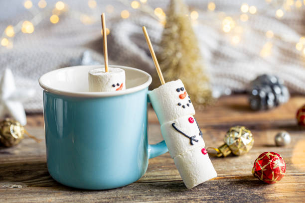 istock Hot chocolate mug and a snowmen made of marshmallows. 1752103985