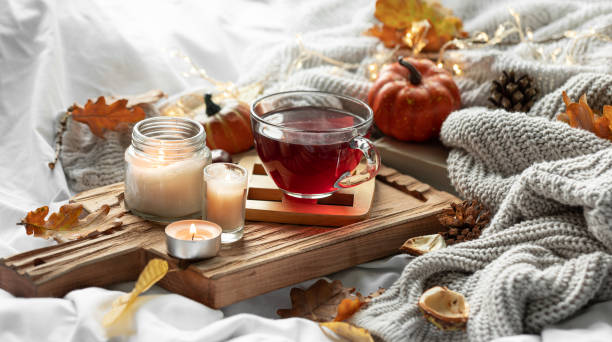 istock Autumn composition with a cup of tea, leaves and a knitted element. 1752105682