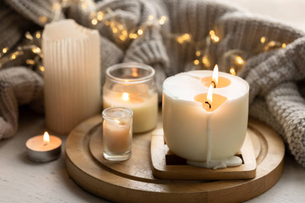 istock A cozy composition with candles, a knitted element and a garland. 1752105698