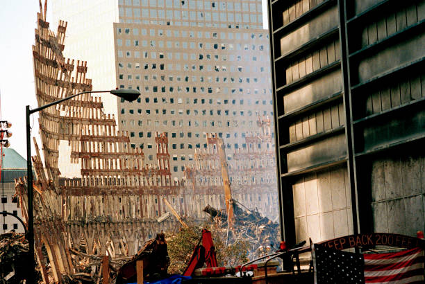 Interrupted image of line of orange paint from squeeze tube Steel Skeleton of World Trade Center Tower South (one) in Ground Zero days after September 11, 2001 terrorist attack which collapsed the 110 story twin towers in New York City, NY, USA. chaos photos stock pictures, royalty-free photos & images