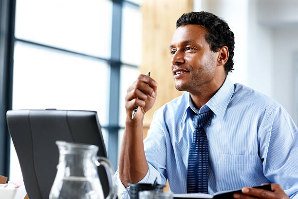 istock Businessman with laptop working at modern office 175210910