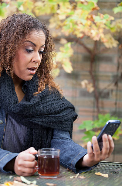 istock Woman with tea and smartphone 175211227