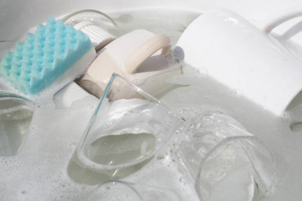 istock Washing used drinking glasses and cups 1752115294