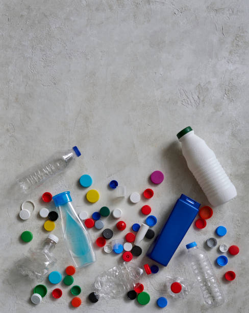 istock Plastic bottles and caps are on the green table, recycling waste concept. 1752116394