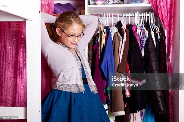 Tween In Front Of Her Open Closet Fixing Hair Stock Photo