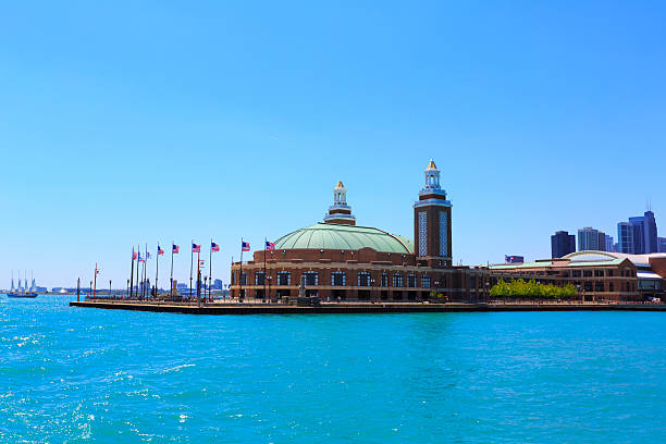 Navy Pier and the modern tower glass buildings of Chicago with Trump, John Hancock and Lake Point tower skyscrapers in the back.\n