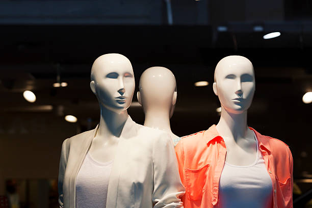 istock Three modern bold female Mannequins in dark background, copy space 175212004