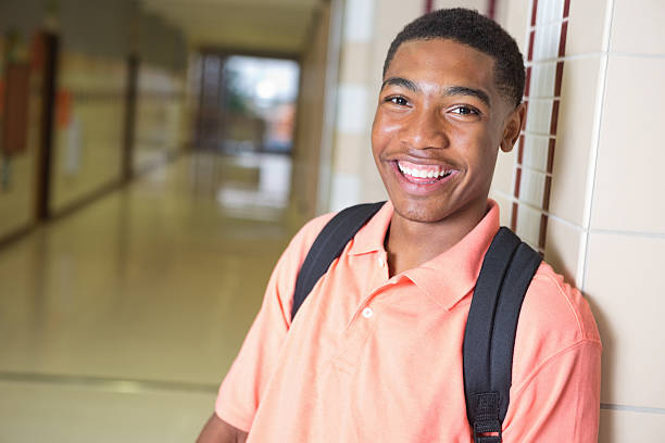 istock Happy high school student in campus hallway 175212134