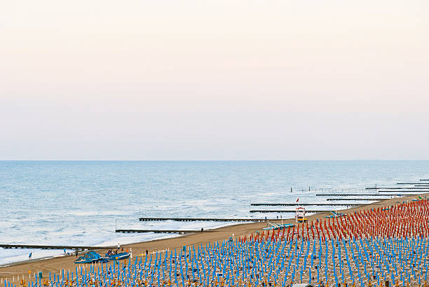 Wonderful capture of venetian beach on a cloudy mediterranean morning. Jesolo, Caorle, Lignano, Rimini, Bibione Beach. Well post-processing. Brands are retouched.