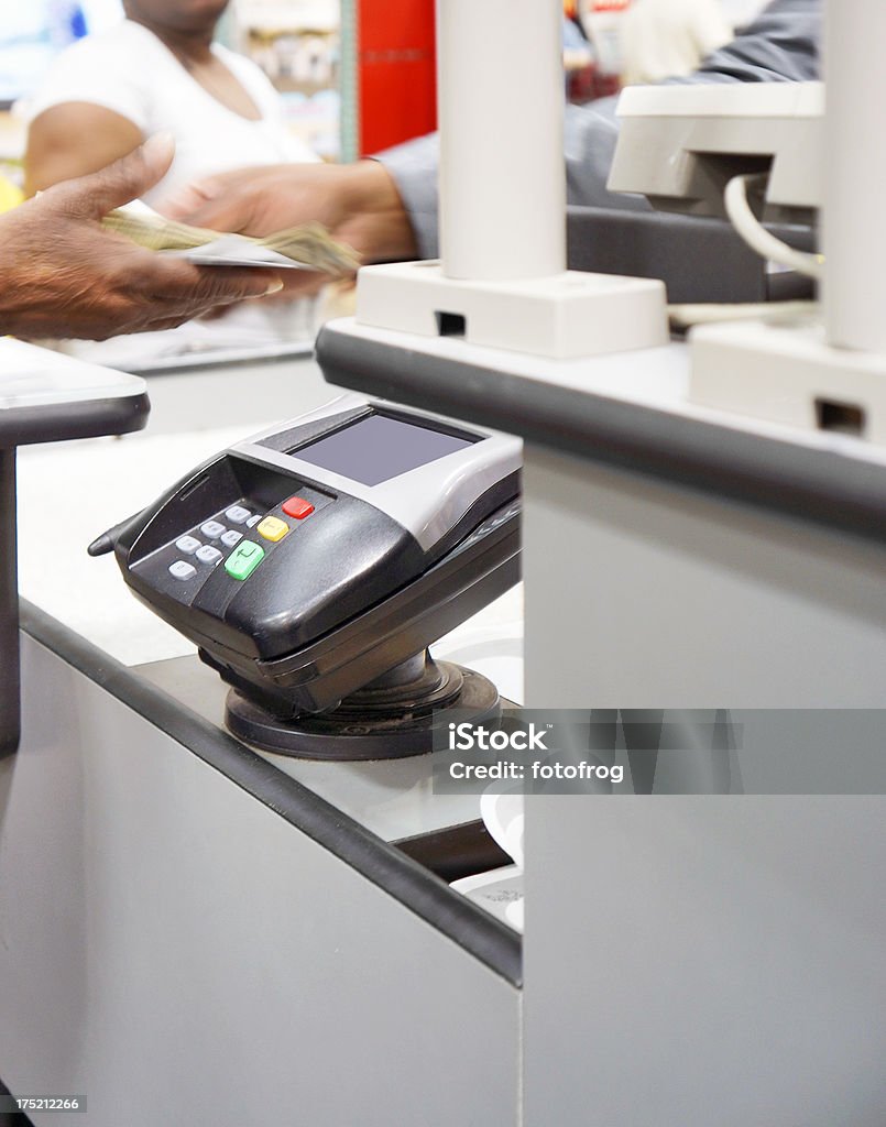 Giving change Cashier hands change over to customer at the checkout counter. Paying Stock Photo