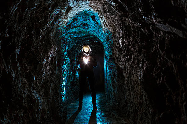 istock Mysterious female fugure in a cave 175212490