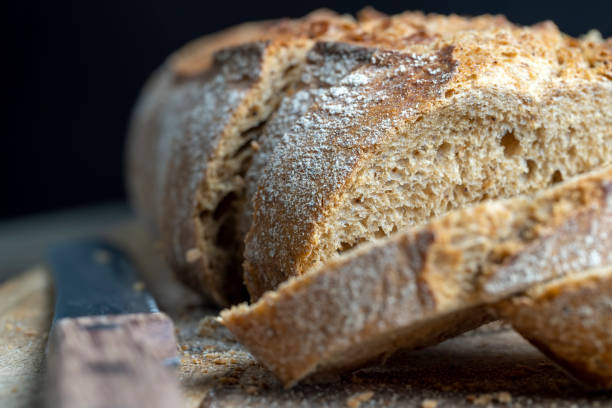 istock Dark wheat loaf of bread 1752130130