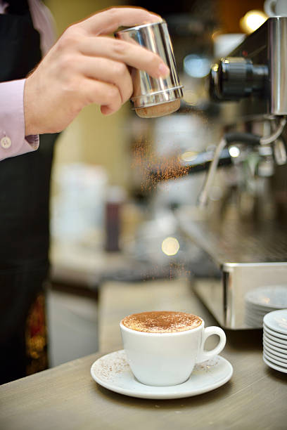 Barista making coffee close up