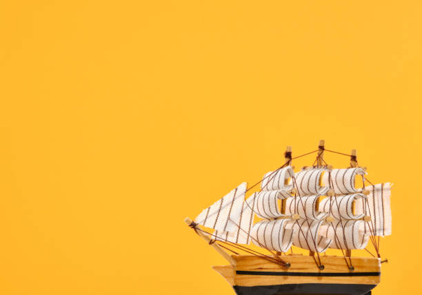 istock Decorative composition of a wooden ship with white sails in voyage. Copy space for text. 1752130765