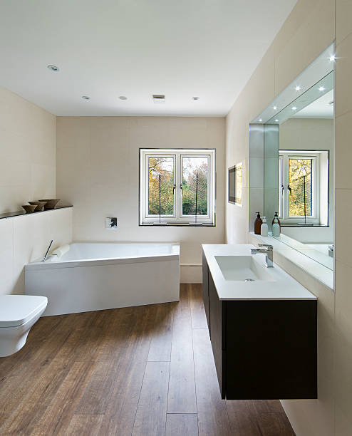 современная ванная комната с деревянным полом - sink bathroom pedestal tile стоковые фото и изображения
