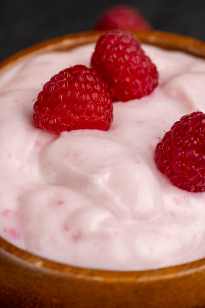 istock fresh yogurt with raspberry flavor, close up 1752131315