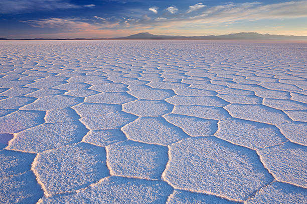 Salt flat Salar de Uyuni in Bolivia at sunrise stock photo