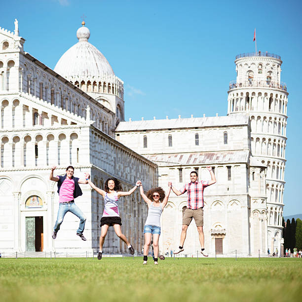 Pisa, Italy - 06 February 2025: Leaning Tower of Pisa and Pisa cathedral during renovation reconstruction works