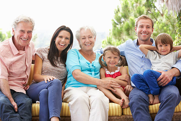 istock Multi Generation Family Sitting On Garden Seat 175213289