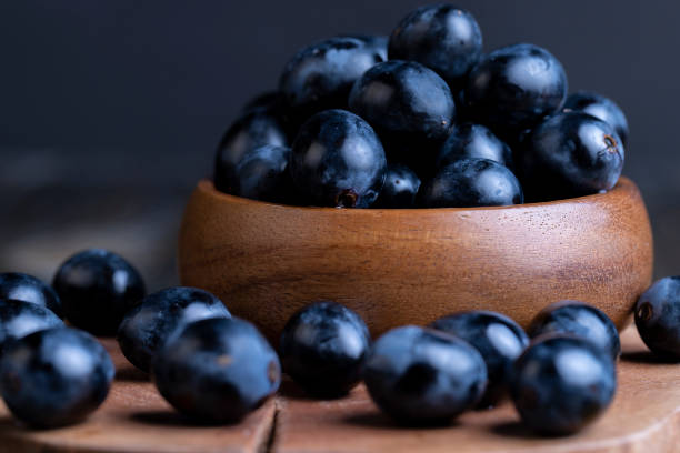 Unwashed blue grapes in the dust