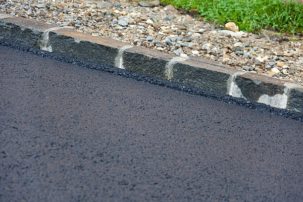 istock Fresh Layer Of Asphalt with Granite Curbs 175213651