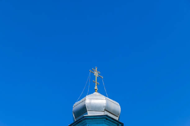 istock wooden christian cross on a blue sky background 1752136818