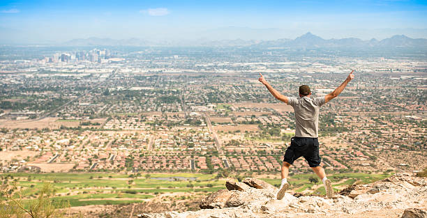 istock jumping against the Phoenix city skyline panorama 175213755