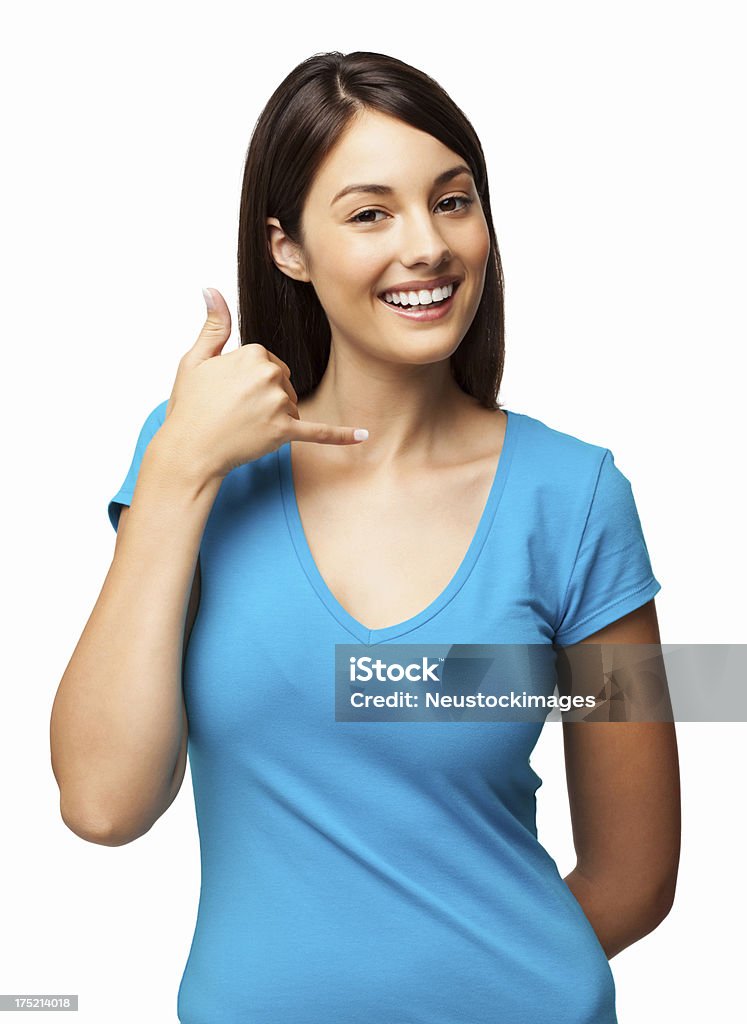 Pretty Woman Making a Call Me Gesture - Isolated Portrait of a pretty young woman making a call me gesture. Vertical shot. Isolated on white. 20-29 Years Stock Photo