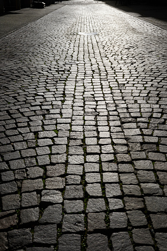 Cobblestone street, backlit situation.