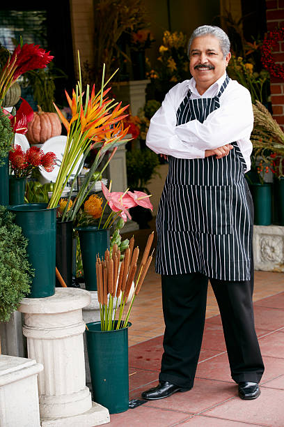 istock A florist standing outside his shop 175215326