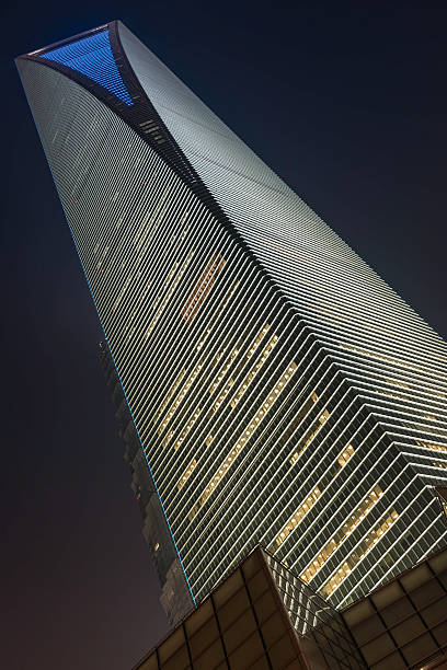 istock Futuristic corporate skyscraper glowing into city night sky 175215343