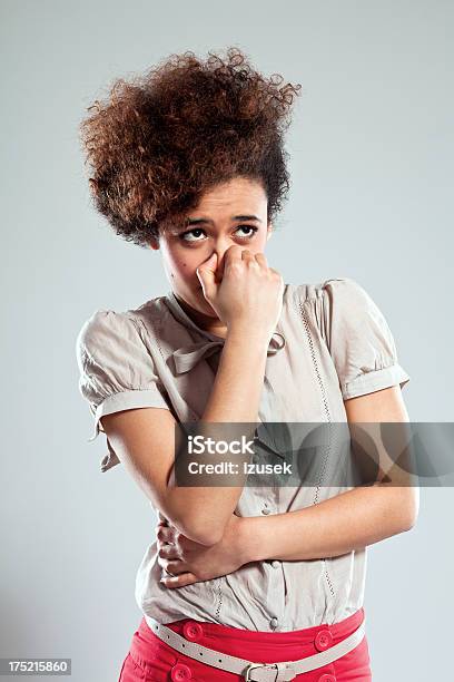 Teen Girl Pinches Nose Stock Photo - Download Image Now - Unpleasant Smell, Smelling, Embarrassment