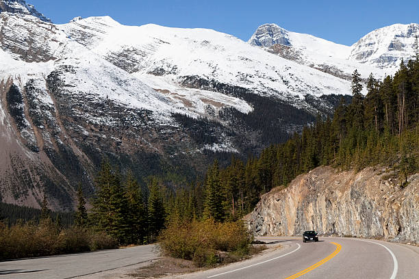 istock Icefield Parkway - car approaching through the mountain pass 175216612