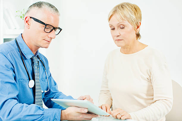 istock Mature Woman At Doctors Office 175216860