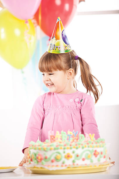 istock Young girl wearing party hat, smiling. 175216970