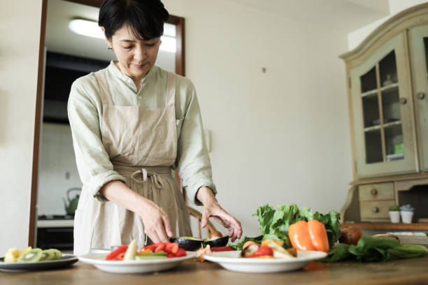 istock Asian Female Prepares a Vegan Meal 1752170819